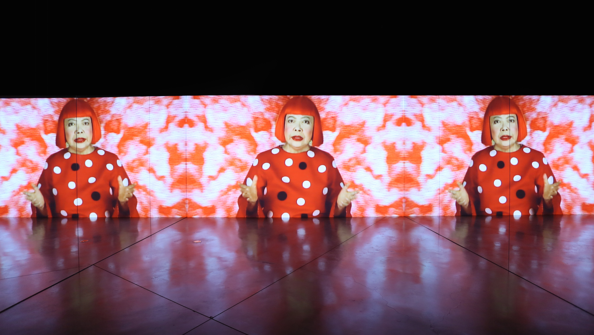Installation of Yayoi Kusama's mannequin covers the exterior of