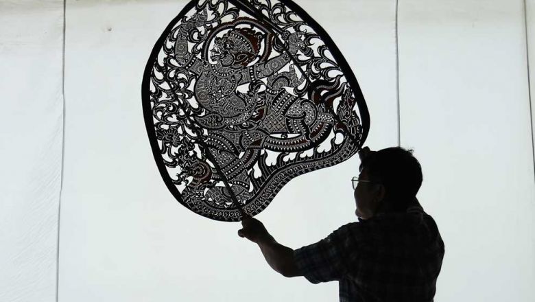 mann_kosal_holds_a_sbek_thom_shadow_puppet._sbek_thom_was_inscribed_in_unescos_list_of_intangible_cultural_heritage_of_humanity_in_2005._hean_rangsey